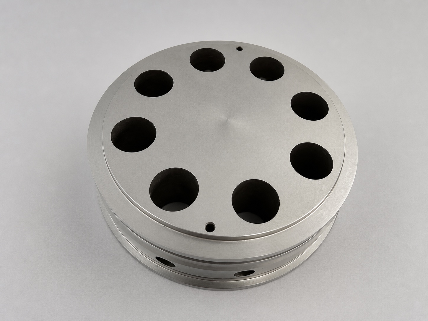 Round machined component with multiple cavities