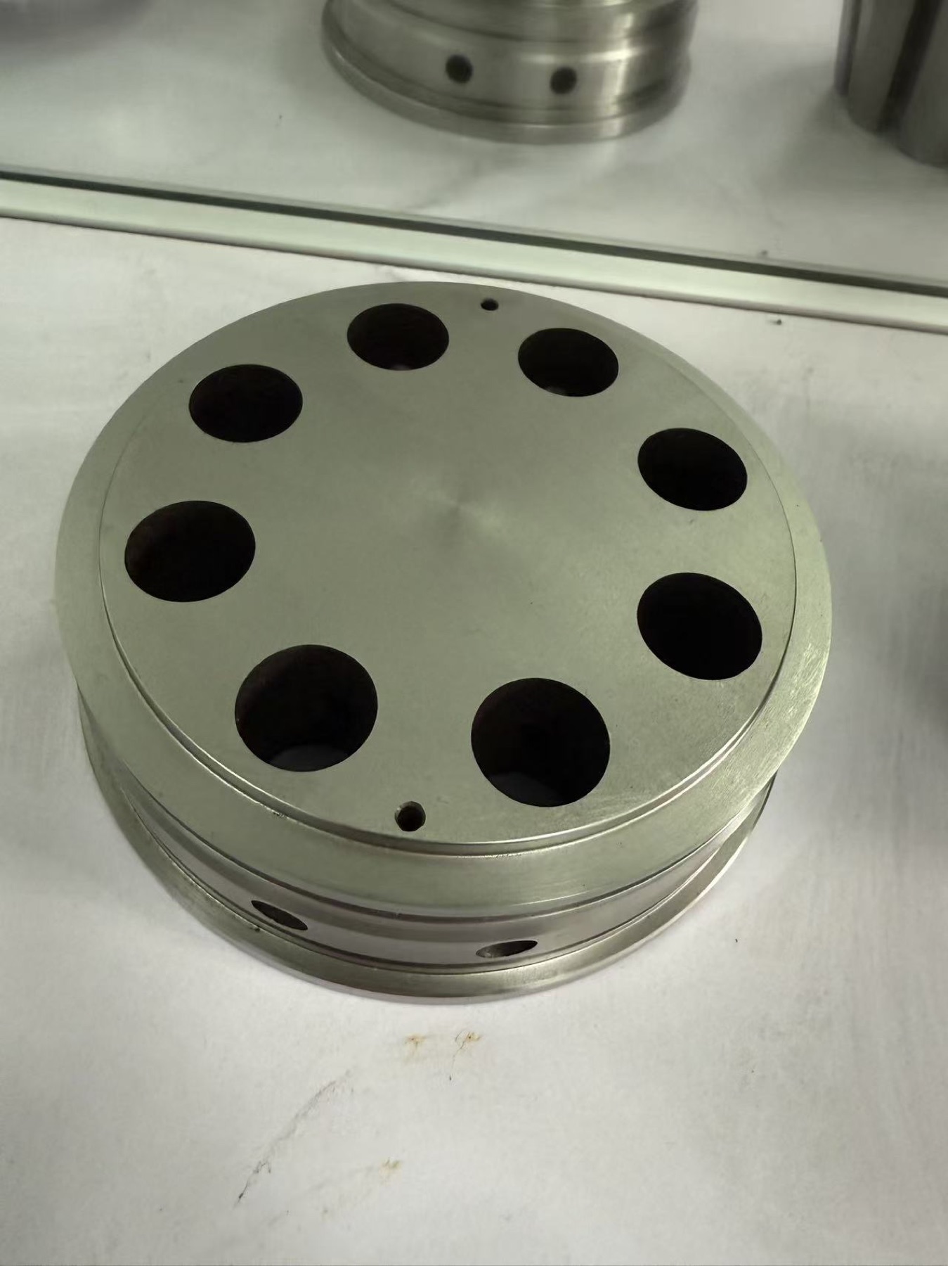 Round machined component with multiple cavities