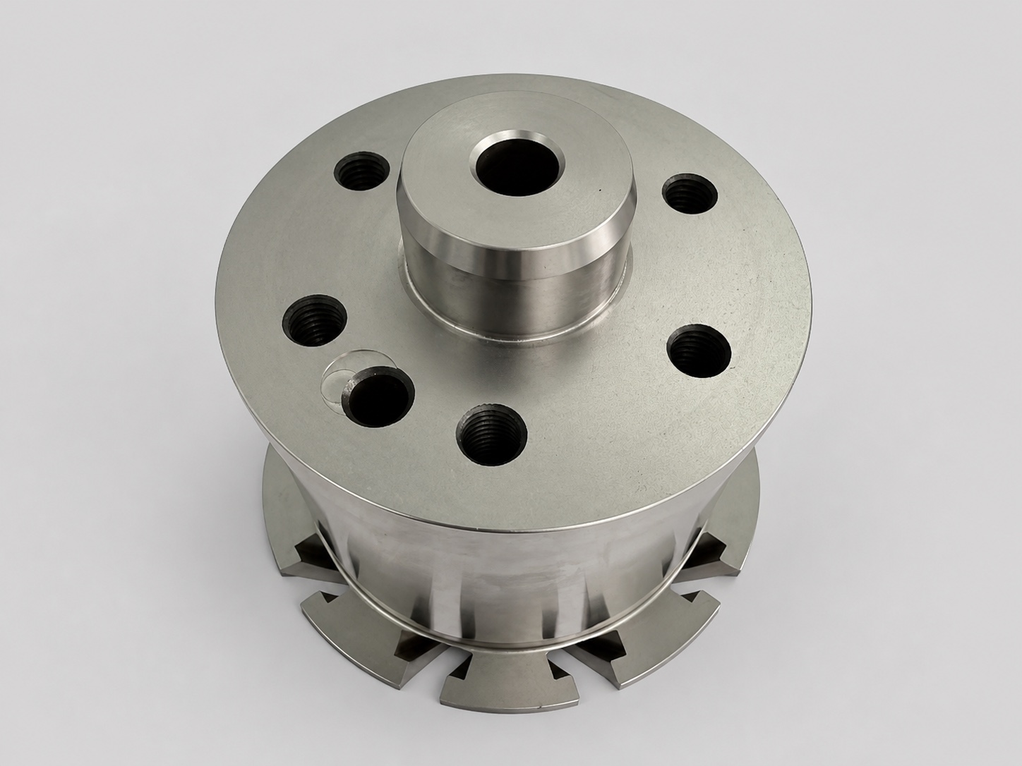 Round precision component with radial machined features