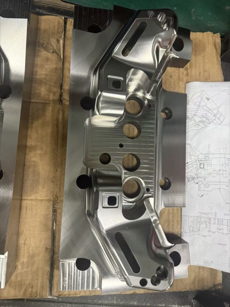 CNC machined stamping die housing with precision mounting surfaces and alignment features