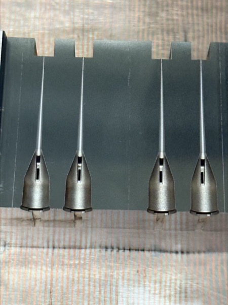 Precision core pins and ejector pins with specialized tip geometry showing ground cylindrical surfaces and controlled diameter