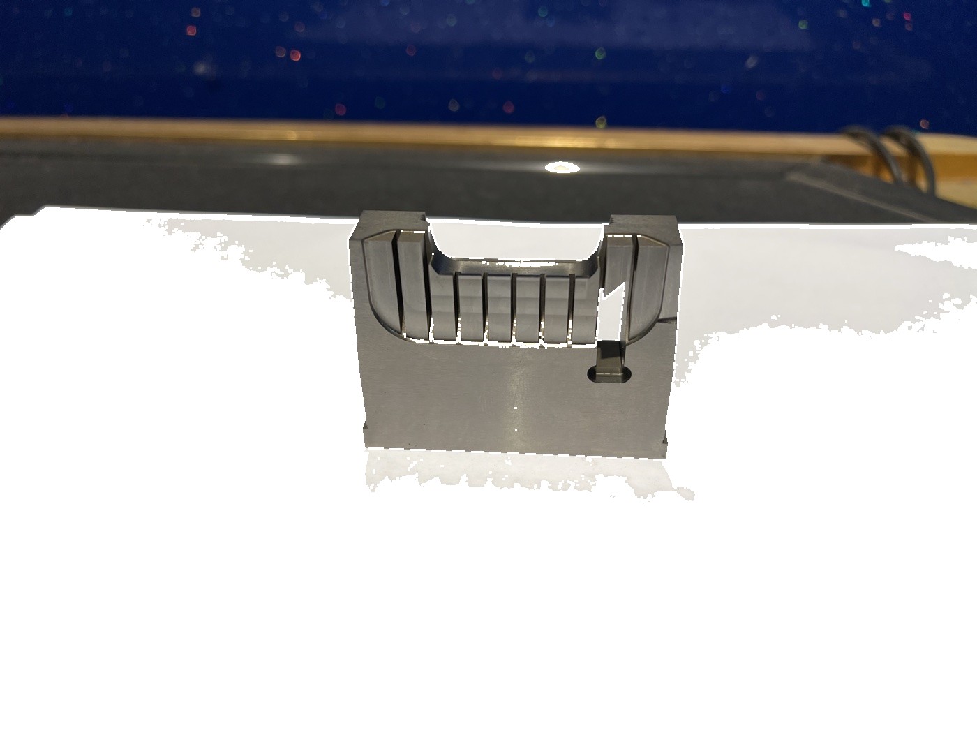 Precision mold insert component showing detailed machined features and assembly interfaces
