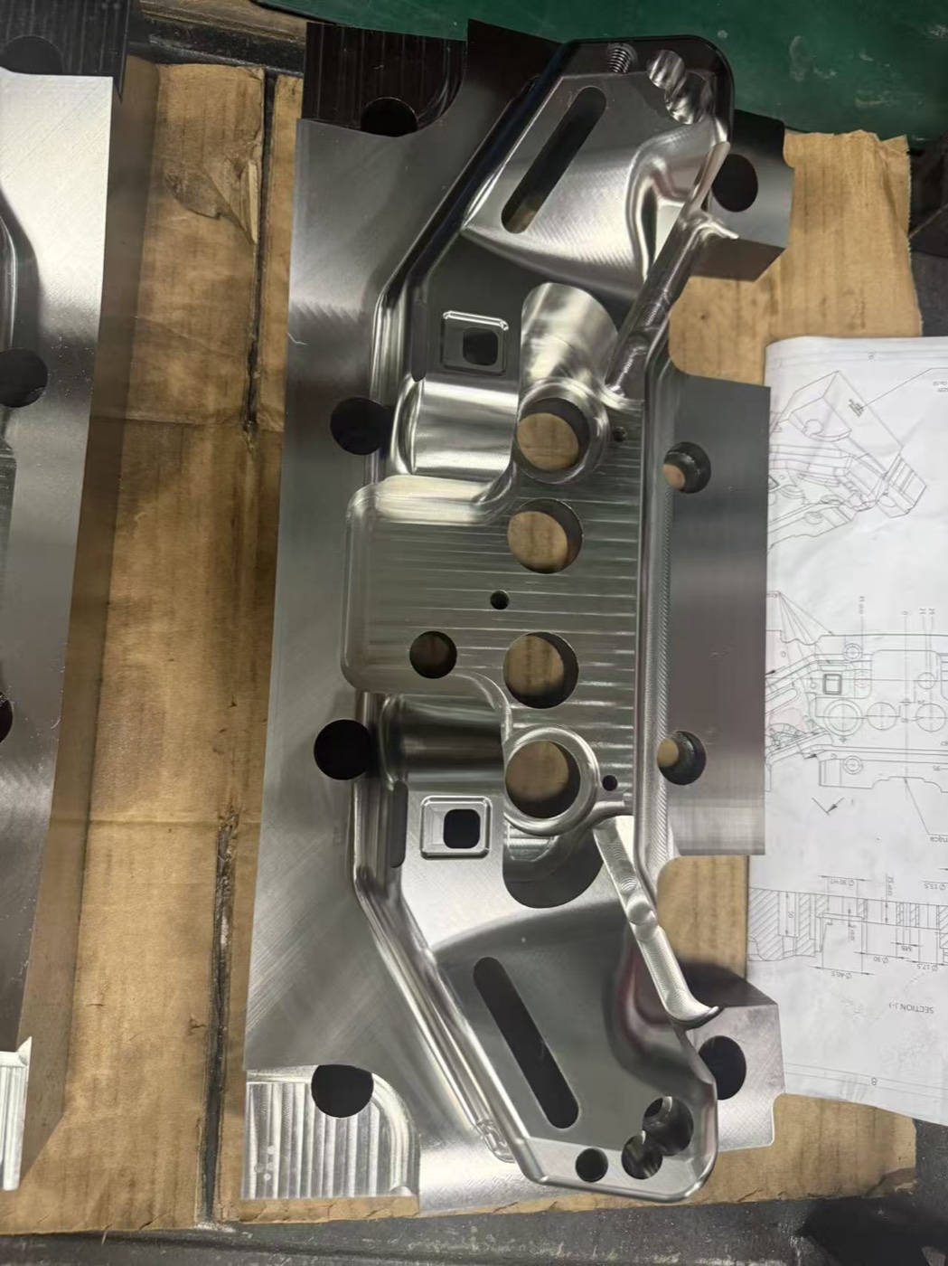 Precision mold cavity beside its controlled engineering drawing