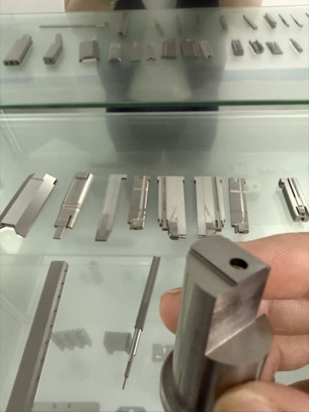 Precision stamping die inserts and punch components showing ground surfaces and controlled geometry for sheet metal stamping